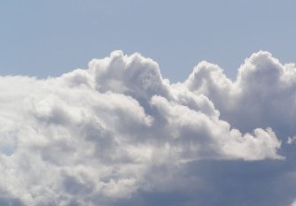 A photo of white, fluffy, cumulus clouds